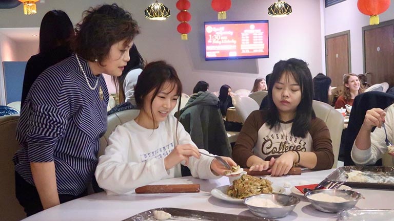 MCFP students making dumplings from scratch at Pinwei Restaurant
