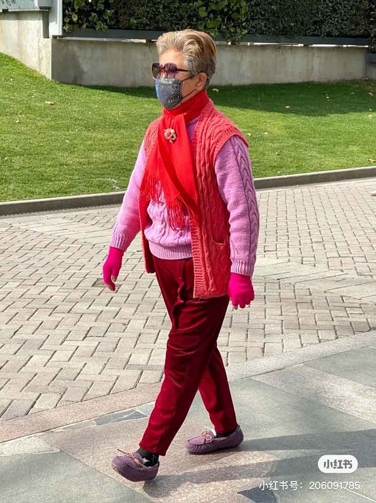 A elderly Chinese lady taking a walk