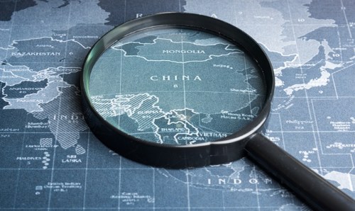 A magnifying glass centred on China on a world map